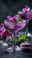 A vibrant purple cocktail adorned with an orchid and mint leaves stands out against a textured dark backdrop.