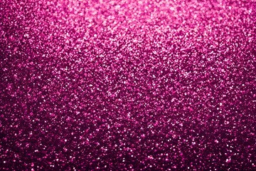 A pink background with glittery dots