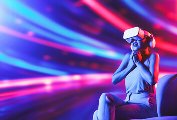 Smart female sitting on sofa surrounded by neon light wearing VR headset connecting metaverse,...