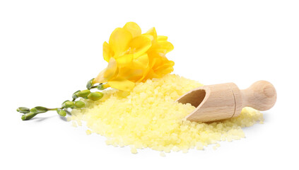 Yellow sea salt, flowers and scoop isolated on white