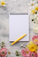 Guest list. Notebook, pen and beautiful flowers on gray textured background, flat lay