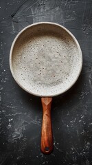 Ceramic non-stick frying pan on dark background