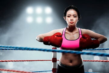 Portrait of a boxing woman with red boxing gloves
