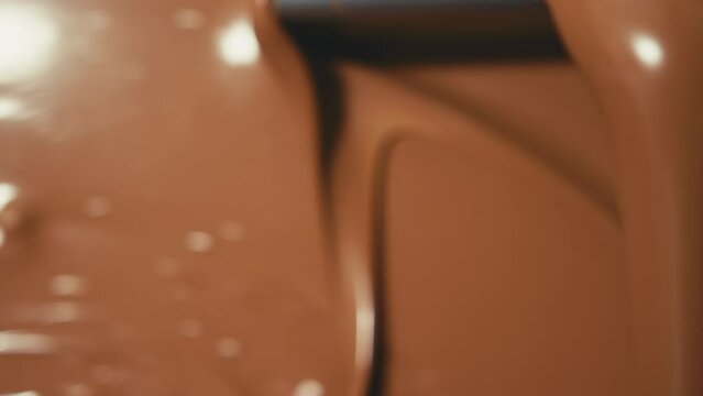 Molten chocolate running out of machine