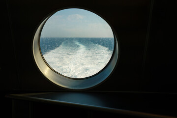 Ocean view through the porthole of a ship