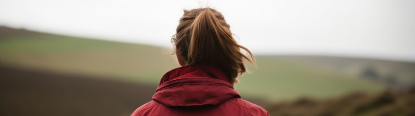 Woman gazing at a scenic landscape