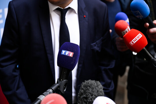 Illustration picture shows a journalist holding a microphone during an interview (mic, mike, micro) with the logo of the French TV channel TF1 in Paris, France on April 25, 2024.