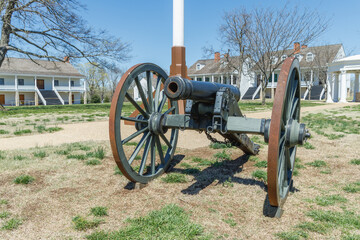 antique cannon in a field at old army fort