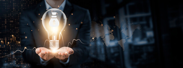 Investment: Innovation, Growth, Sustainability Concept. Hands of Businessman Holding Light Bulb and...