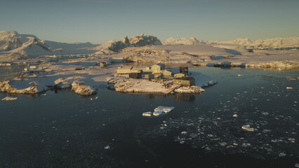 Antarctica Vernadsky Station Sunset Aerial View. Ocean Coast Open Water Glacier Surface. South Pole...