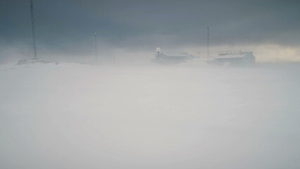 Blizzard Over Vernadsky Station. Antarctica Aerial Flight Over Snow Covered Land. Drone Polar...