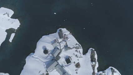 Polar Antarctica Vernadsky Base Aerial View. Ocean Coast Open Water Surface Wild Arctic Nature....