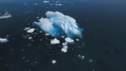 Majestic Antarctica Iceberg Motion Aerial View. Deep Open Arctic Floe Ocean Water Seascape Surface...