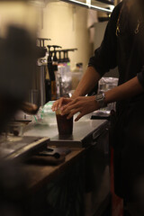 Closeup of Iced Caramel Macchiato at the coffee shop, Caramel Macchiato is a classic macchiato beverage. It consists of vanilla syrup, espresso, steamed milk, foam, and caramel drizzle
