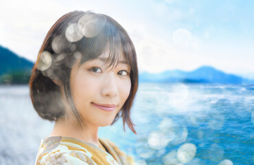 若い女性とキラキラした青空や青い海の背景。多重露光。