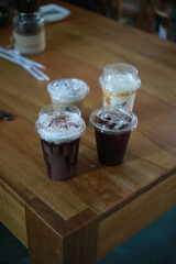 Closeup of Iced Caramel Macchiato at the coffee shop, Caramel Macchiato is a classic macchiato beverage. It consists of vanilla syrup, espresso, steamed milk, foam, and caramel drizzle