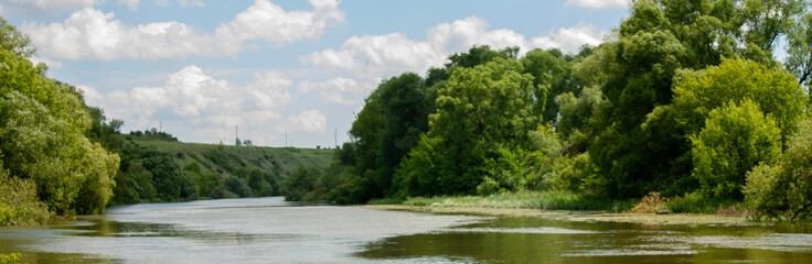 The Zusha River flows in the middle zone of Russia. The banks of the river are steep and rocky with...