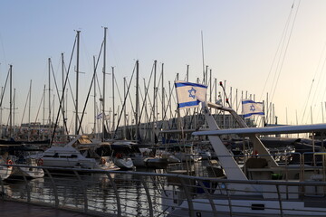 Masts in the port against the blue sky.