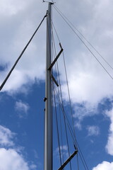 Masts in the port against the blue sky.