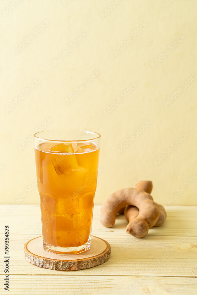 Wall mural Delicious sweet drink tamarind juice and ice cube