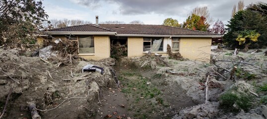 Silt and house buried and damaged in the Cyclone Gabrielle natural disaster. Eskdale, Napier,...