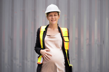 Portrait Happy caucasian logistic engineer pregnant woman  working at container site	