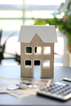 Real estate and finance concept with white piggy bank and Japanese money
