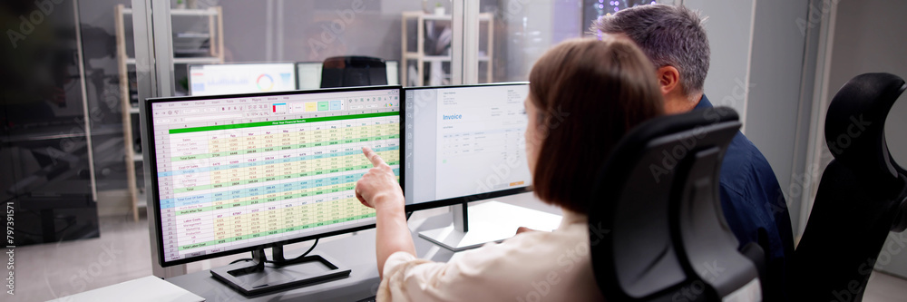 Poster working analyst at desktop computer