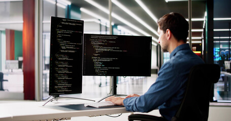Web Developer Looking At Code