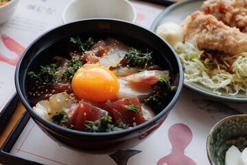 Tuna donburi; a bowl of rice topped with tuna