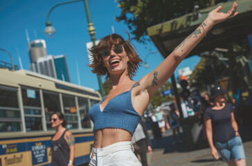 A young woman with short brown hair and a blue top and white pants is dancing in front of the bus...