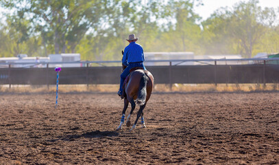 Cowboy on horseback at a rodeo campdraft