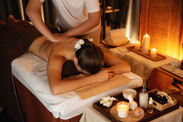 Caucasian woman customer enjoying relaxing anti-stress spa massage and pampering with beauty skin...