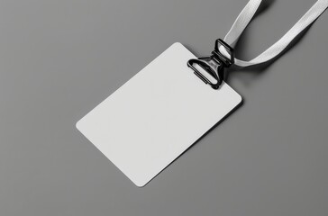 Mockup of a blank white nametag label lying on a grey background, perfect for presentations, events, and identification purposes - obrazy, fototapety, plakaty