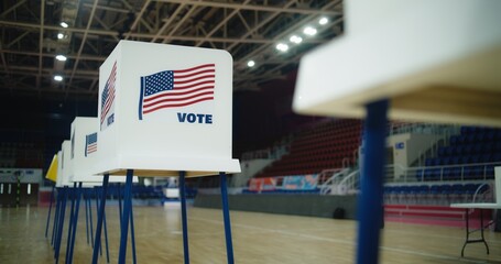 National Election Day in the United States of America. Voting booths with American flag logo at polling station. Political races of US presidential candidates. Concept of civic duty and democracy.