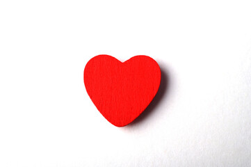 photo of red heart on white background, symbol of love
