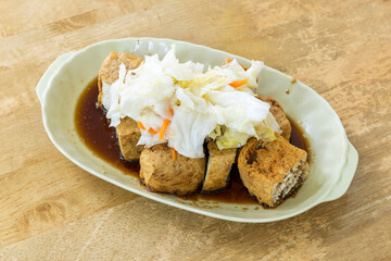 Close-up of delicious stinky tofu. it is a street snack commonly found at night markets or roadside...