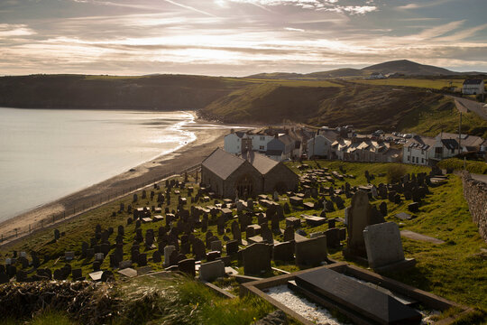 St. Hywyn's Church and the village of Aberdaron, Wales. Aberdaron is on the coast of the Llyn Peninsula in Gwynedd, North Wales.