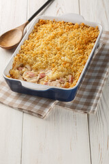 Chicken Cordon Bleu Casserole with chicken breast, cheese and ham melted in cream closeup in the...