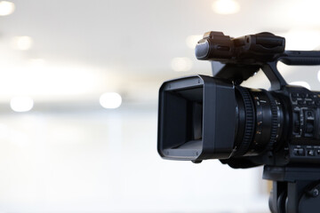 Video camera with blur background for journalist interview broadcasting reporter news or press conference speaker or public speaking or meeting report record and content creator live media concepts.