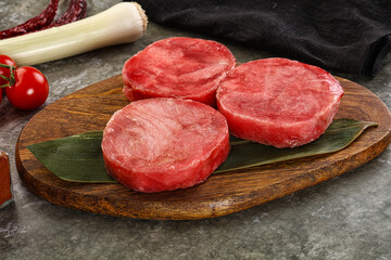 Delicous raw tuna medallion for cooking