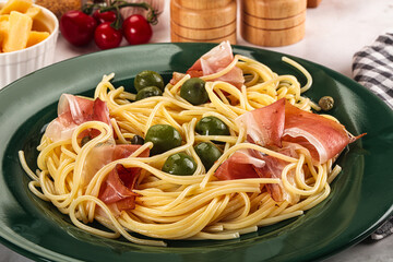 Pasta spaghetti with olives and jamon