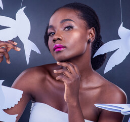 Black woman, paper bird and portrait for freedom, peace and wellness isolated in dark background....