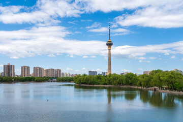 Beautiful view of Yuyuantan park with jumping carp and CCTV tower of Beijing