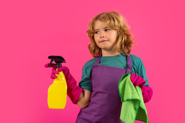 Kid helping with housework, cleaning the house. Cleaning accessory, cleaning supplies. Studio isoalted portrait of child helping with housework, cleaning the house. Housekeeping, home chores.