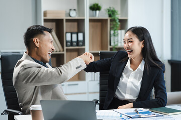 Happy smiling businessman feel happy work complete Teamwork success, success at work in the office concept.