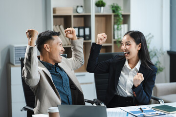 Happy smiling businessman feel happy work complete Teamwork success, success at work in the office...