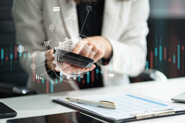 Businesswoman working with tablet and using a calculator to calculate the numbers of static in...