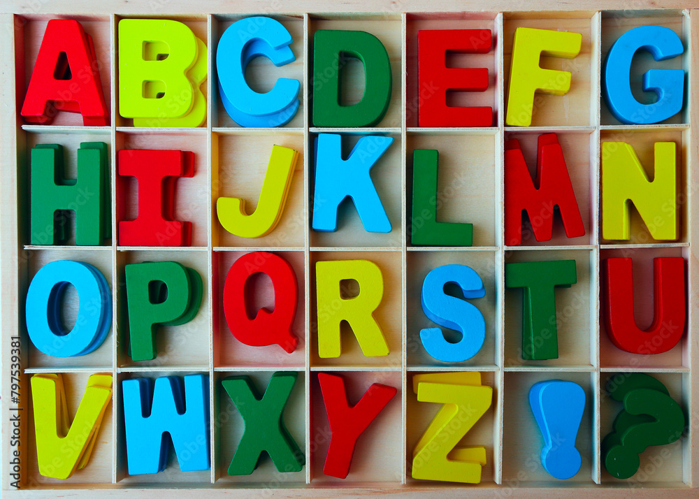 Fototapete wooden box of colorful wood english letters. front view. letters and signs for diy. letters in frame