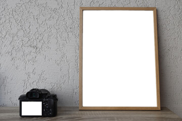mockup of wooden empty Photo frame mirrorless photo camera on wood shelf. mock-up. design of living room with poster mock up frame. white wall background. home decor. Template lcd screen monitor